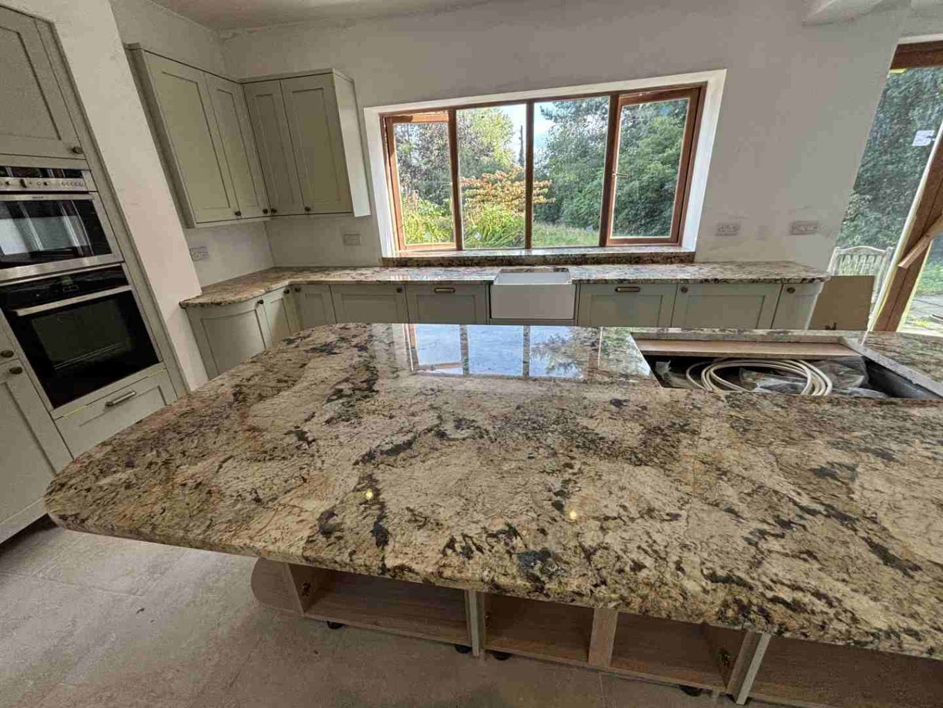 light granite worktop fitted to a kitchen island